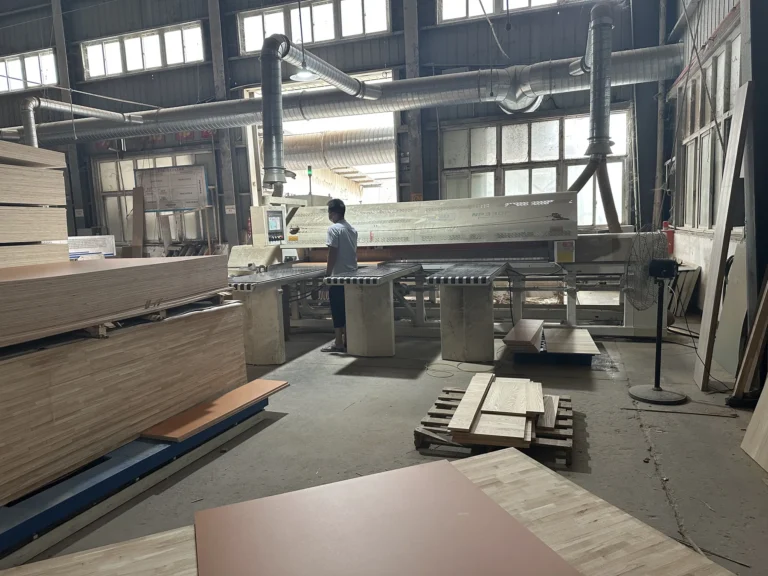 Panel cutting equipment preparing components for hotel casegoods