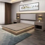Taupe platform bed with LED strip under the base, padded headboard panel with backlit edge and two nightstands