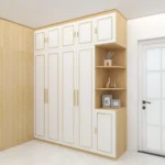 Tall white wardrobe with light-oak sides, five top doors and a corner stack of open shelves