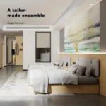 Twin beds with gray padded headboards on a light-wood backboard, with a mural of a golden tree behind