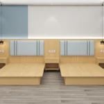 Twin light-oak platform bed bases side by side with pale blue headboards and three nightstands