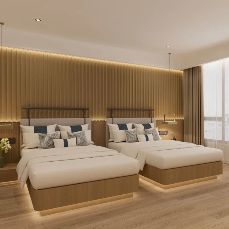 Two beds with warm-wood bases and light gray headboards in front of a slatted wood wall, with LED light under the bases