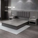 Gray-tone platform bed with a dark gray padded headboard in vertical strips and two open-shelf nightstands