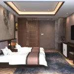Room view with twin beds, a desk with cabinet and stool, a wall-mounted TV and lattice-pattern wood screens