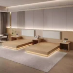 Two light-wood platform bed bases with cream padded headboards, open-shelf nightstands and a warm glow under the bases