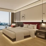 Dark-brown platform bed with a red padded headboard, a dark nightstand with open niche, a pendant lamp and a window chair