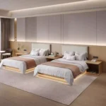 Twin layout with two made-up beds, brown runners and cream padded headboards on a wood backboard