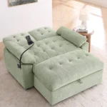 Sage green tufted loveseat with the back lowered and the storage ottoman pushed up as a bed