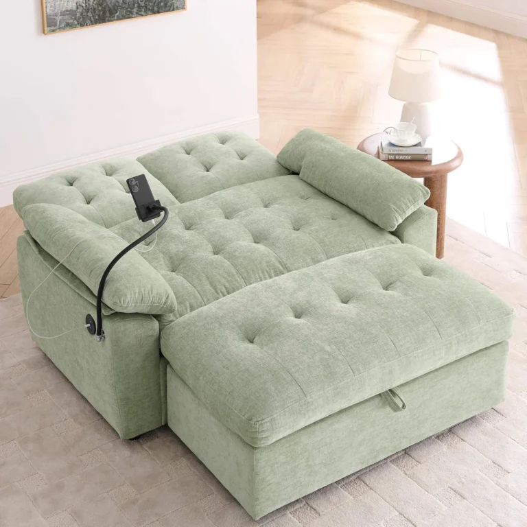 Sage green tufted loveseat with the back lowered and the storage ottoman pushed up as a bed