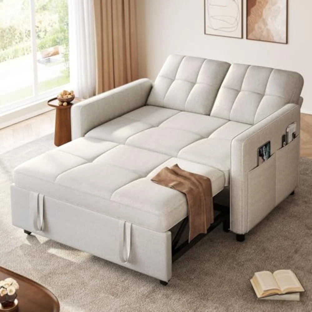 Ivory linen loveseat pulled out into a bed in a living room