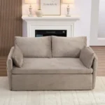 Taupe loveseat in front of a fireplace