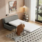 Ottoman guest bed opened in a bedroom with a throw blanket
