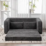 Unfolded foam sofa bed on a patterned rug