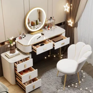 White vanity with the cabinet at the left, three cabinet drawers and two desk drawers pulled open, and a petal-back chair