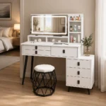 White vanity desk with an LED mirror, a shelf unit, drawers and a hexagonal stool, in a beige bedroom