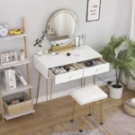 White vanity with both drawers pulled open, showing skincare bottles, and a padded stool with gold-tone legs