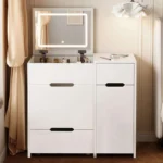 White vanity cabinet with the flip-up LED mirror raised, a wide drawer and a side cabinet, between curtains