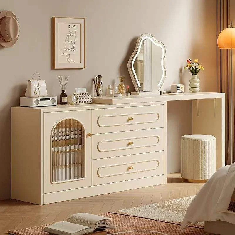Cream cabinet vanity with a cloud-shaped LED mirror, an arched glass door, three drawers and a round fluted stool