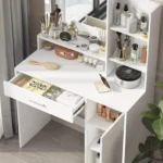 Close-up of the white vanity with the drawer and the cabinet door open, and cosmetics on the shelves