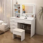 White vanity with an LED touch mirror, open shelves, four stacked drawers, a wide drawer and a padded stool, in a bedroom