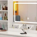 Close-up of the LED touch mirror, the open shelves and the divided ledge with cosmetics