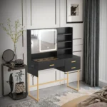 Black vanity desk with an LED mirror and open shelves, beside a round side table with a small mirror