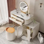 Cream vanity with both desk drawers and the cabinet doors open, showing shelves, a pull-out rack and a stool with a tan top